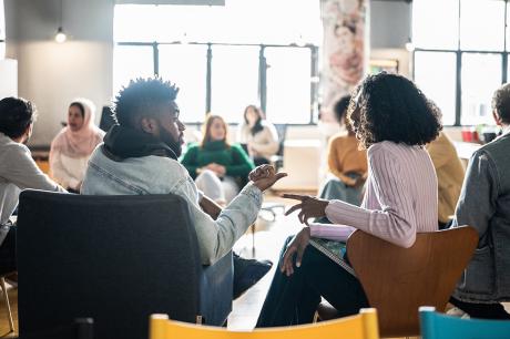 Adult Students Talking In The Classroom