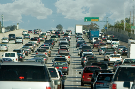 Photo of many cars in traffic on a highway.