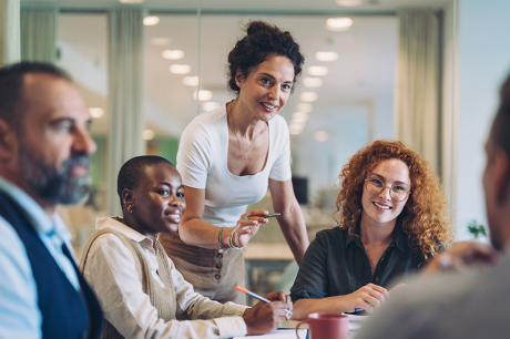 A group of professionals working together in a conference room